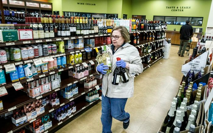 woman buying wine