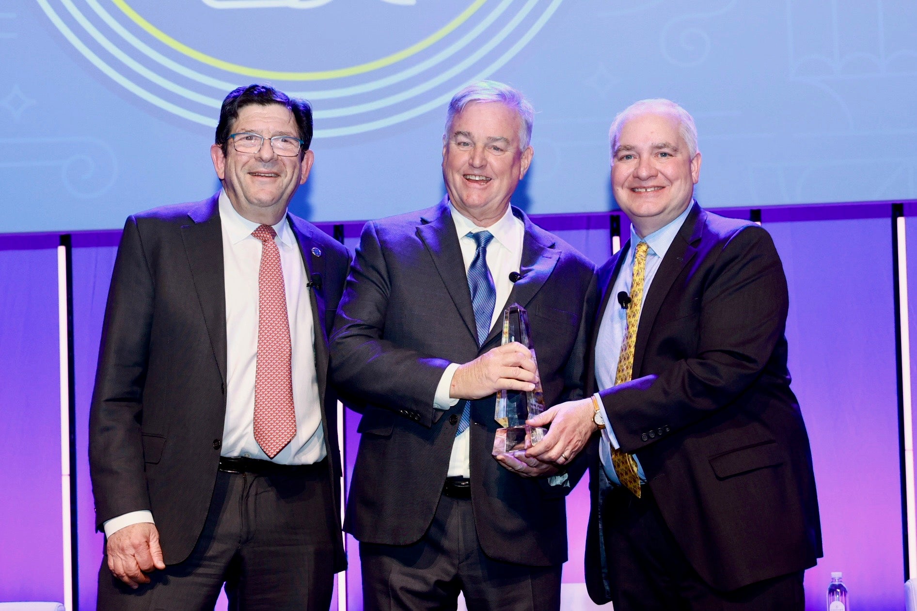 David Trone (center) accepts H.E.R.O. Award at Access LIVE 2026